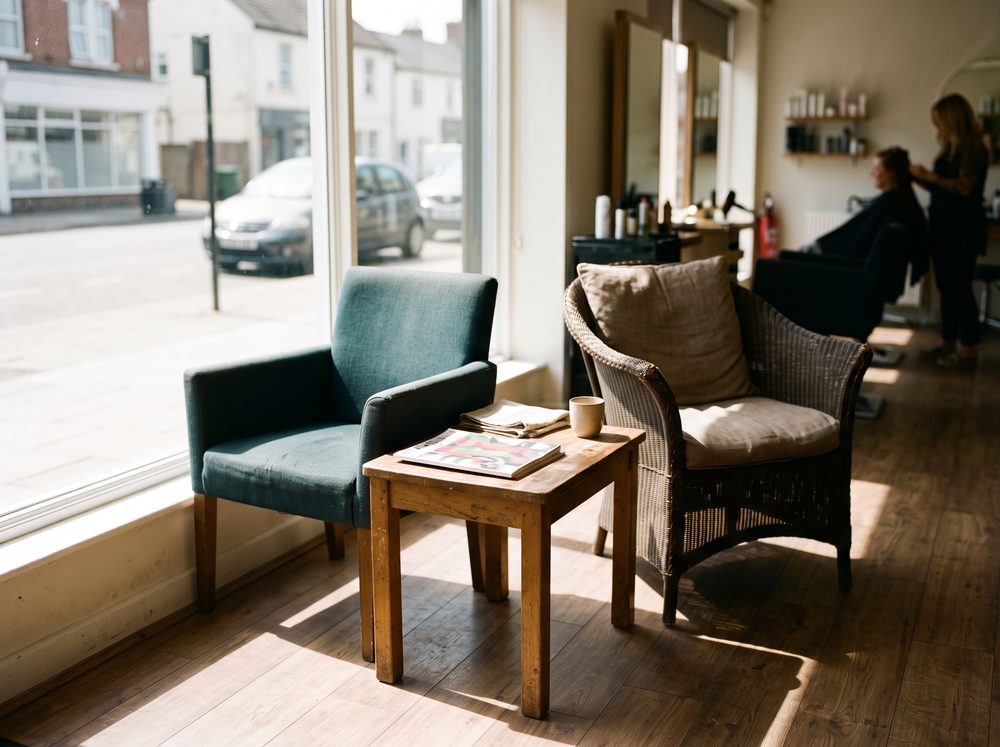 Two waiting chairs in the sun by the front window